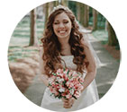 A smiling bride holding a bouquet